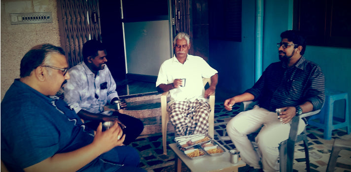 Group photo of four people sitting