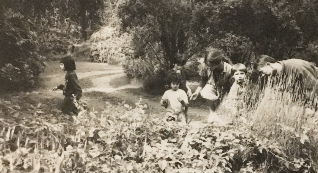Two guys standing in field of crops