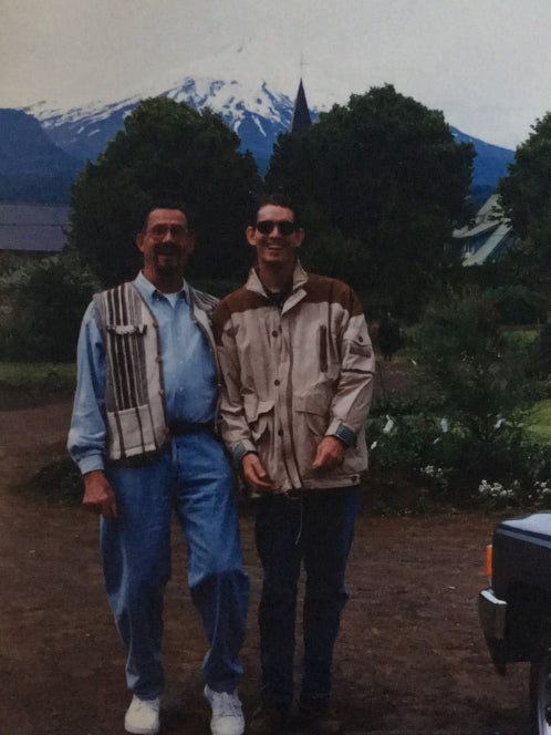 Two men with mountains in background
