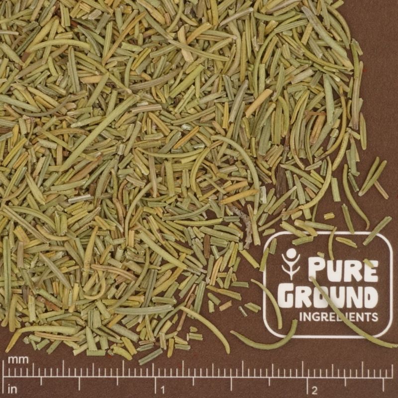 Dry rosemary herbs on a brown background with 'Pure Ground Ingredients' label